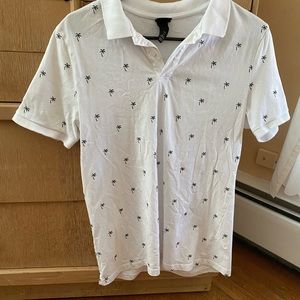 White shirt sleeve button up shirt covered with palm tree emblems. Size M. H&M